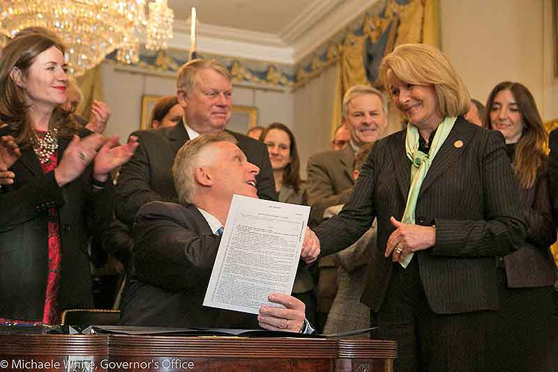 Governor Terry McAuliffe signing gun safety compromise bills into law, February 26, 2016. Copyright Michaele White, Governor's Office