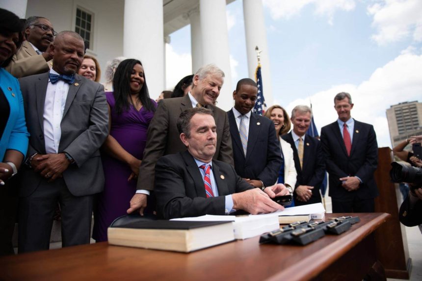 Governor Ralph Northam signs the 2018 budget bill into law which expands Medicaid in the State of Virginia, June 7, 2018